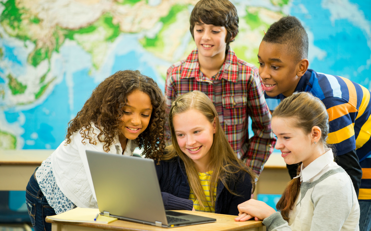 School children using technology because of broadband grants